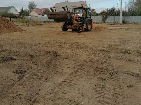 Разровнять участок трактором.
